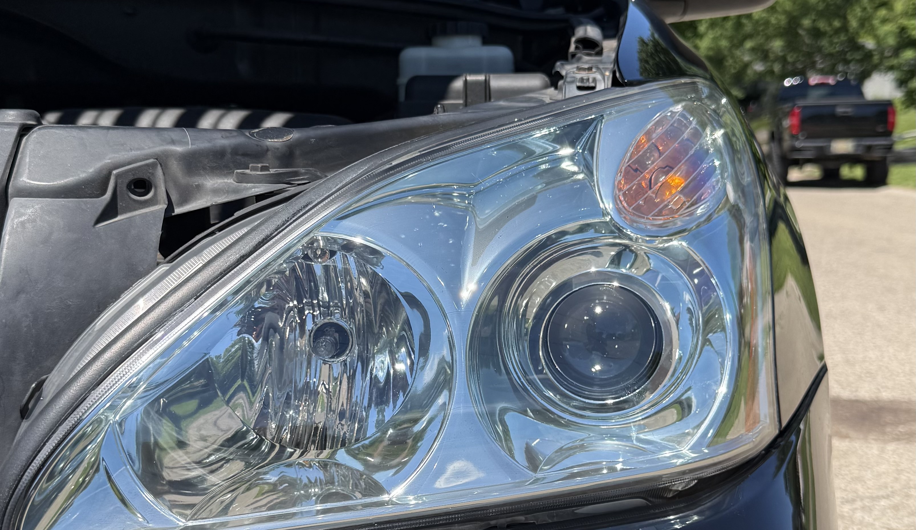 A clear restored headlight after detailing in Hyde Park
