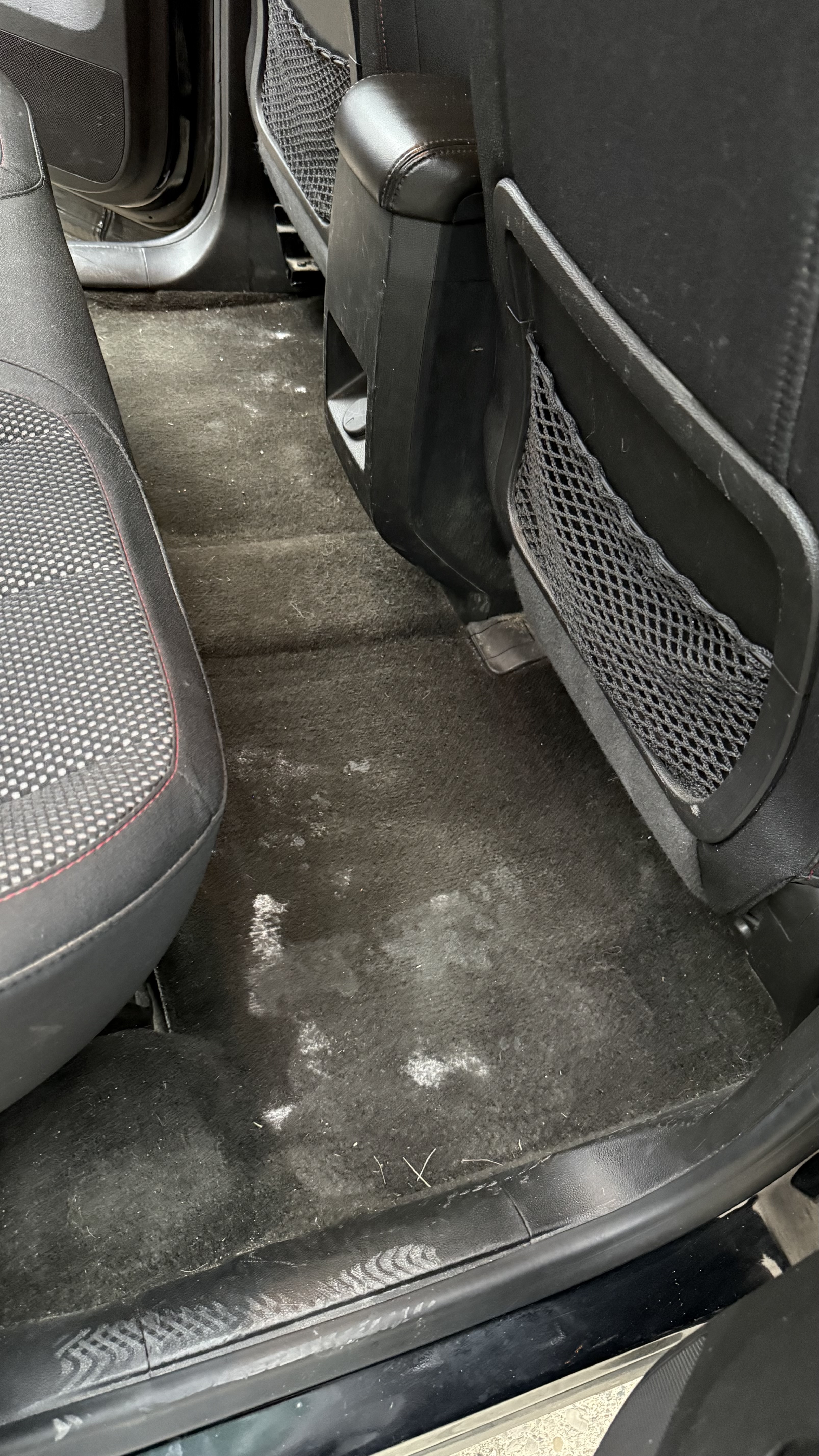 Dirty car floor before deep clean