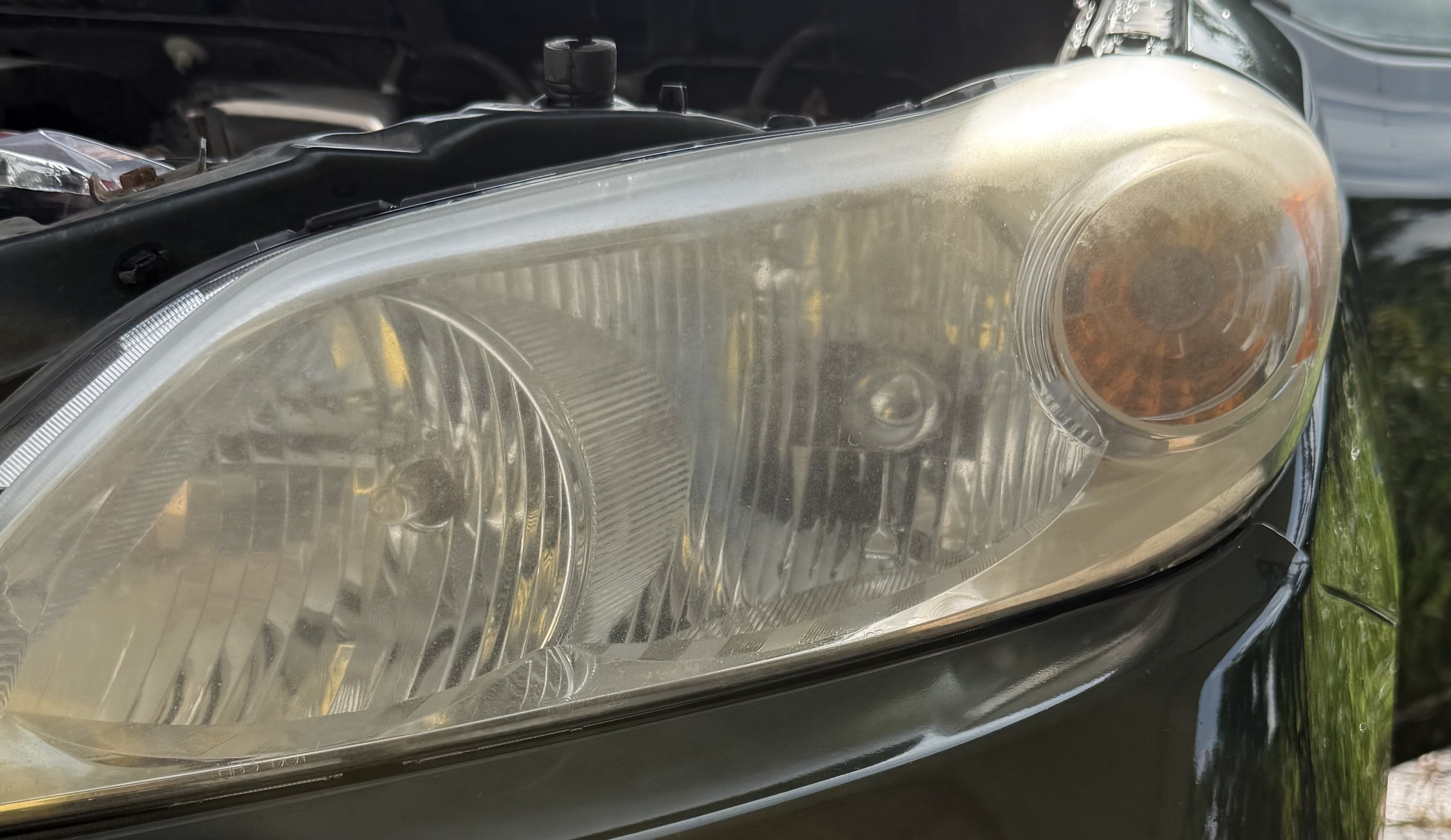 Foggy yellowed headlight before restoration Cincinnati