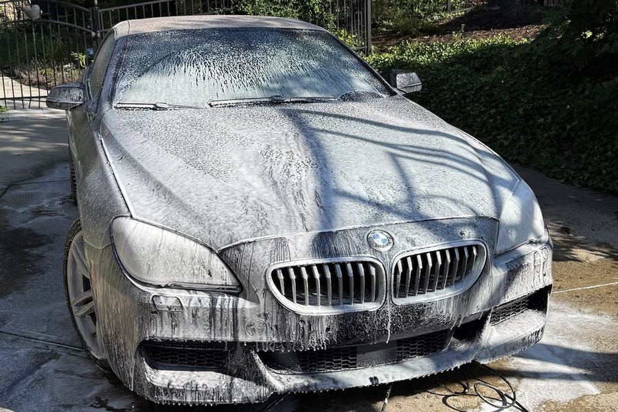BMW covered in foam pre-soak during a mobile car detail by Onyx Pristine Co. in Cincinnati