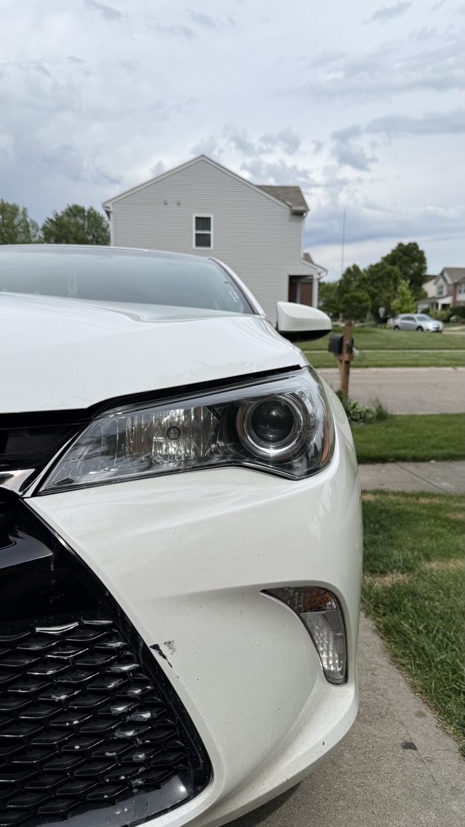Crystal-clear headlight after Onyx Pristine restoration — white Camry Cincinnati