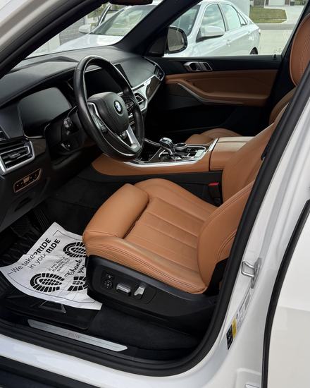 BMW X5 tan leather driver seat after an interior detail