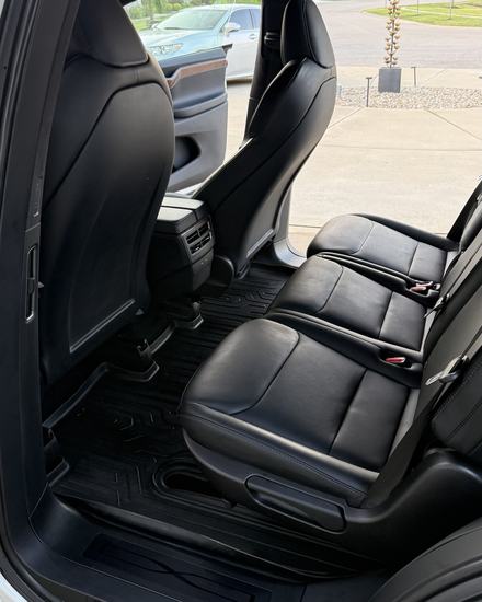Tesla Model X rear seats and floor liners after an interior detail