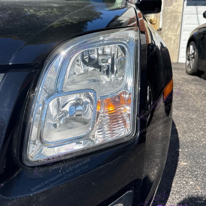 The same Ford Fusion headlight after restoration: crystal clear